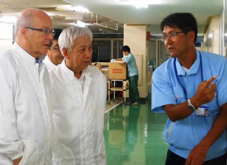 Mr. Tadashi Kikuchi (right) talks about the swift re-start in March, 2011