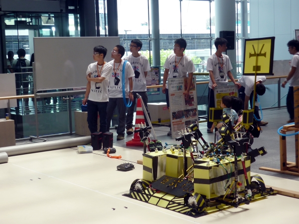 Showing off a robot made by students from Ichinoseki College of the National Institute of Technology