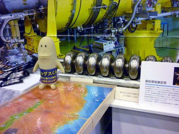 Higgs-kun hangs out at the ILC booth with the SCRF cavity